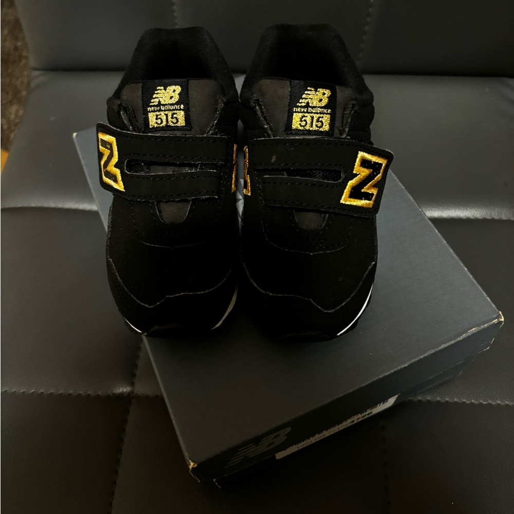 New balance black and gold unisex